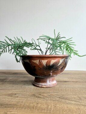 Ceramic planter/footed bowl with carved floral botanical pattern. Some patina.